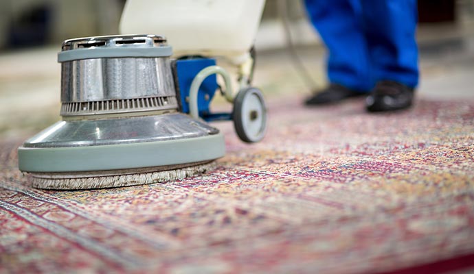 Rug cleaning with an electric vacuum cleaner.